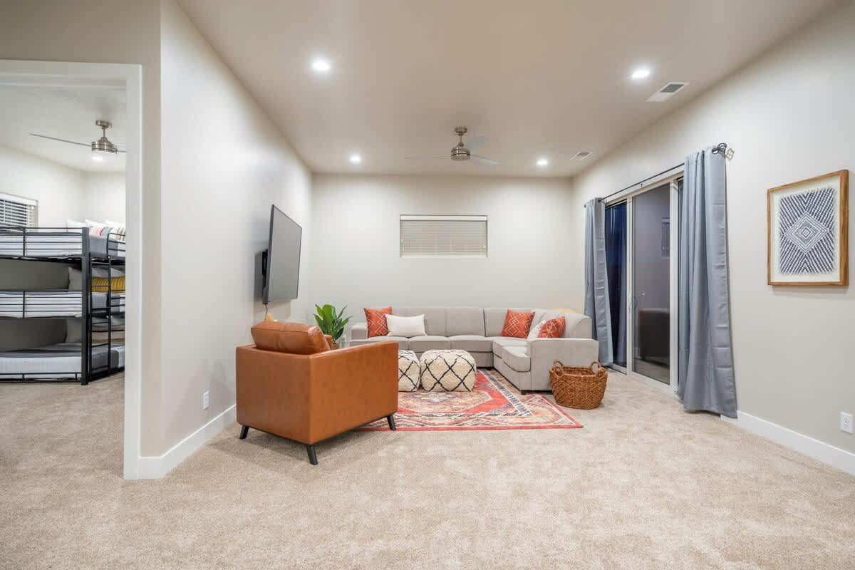 Family room 2 with comfortable sectional seating and balcony