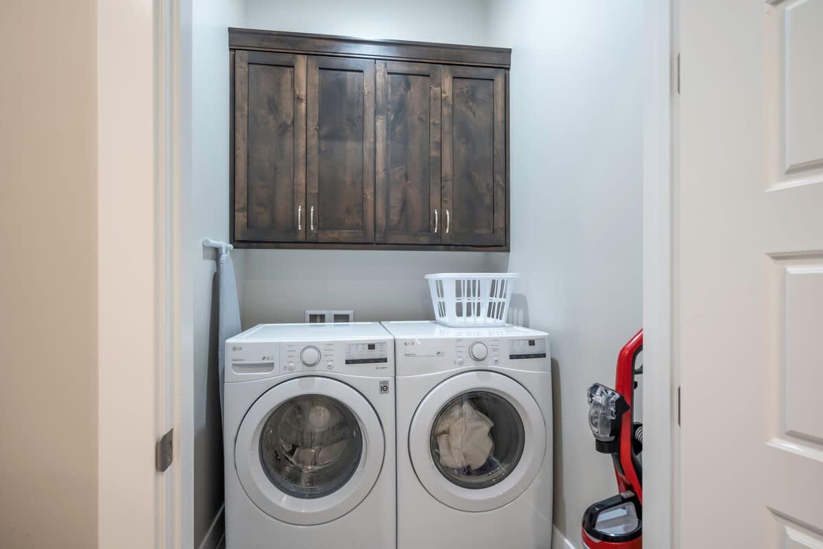 Laundry room with front loading washer and dryer