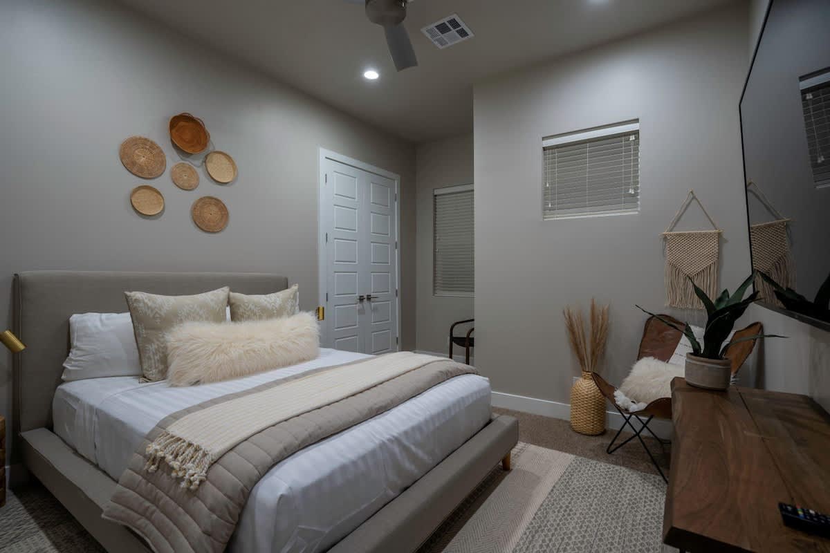 Bedroom 5 with king platform bed and large TV