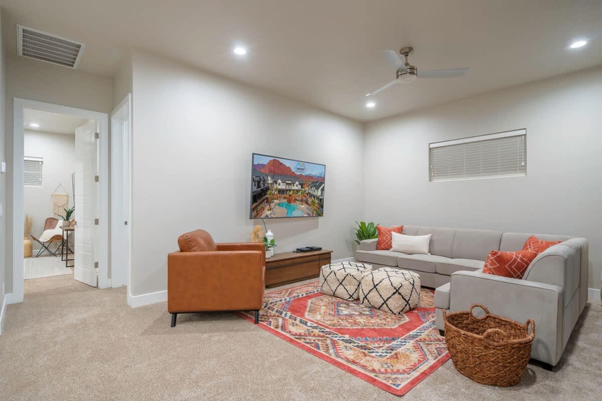 Family room 2 with sectional sofa, chairs, and TV