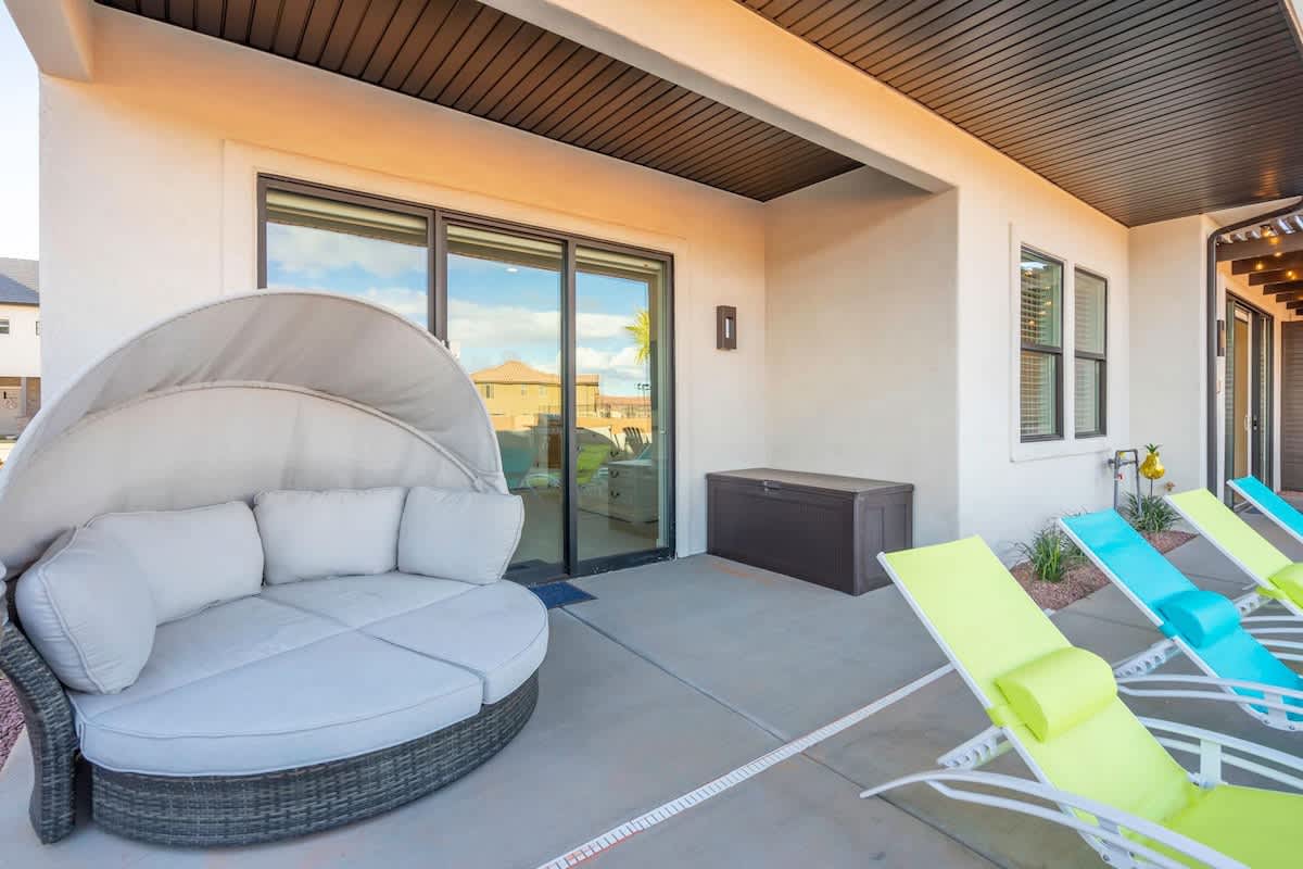 Poolside covered patio off master bedroom with lounger