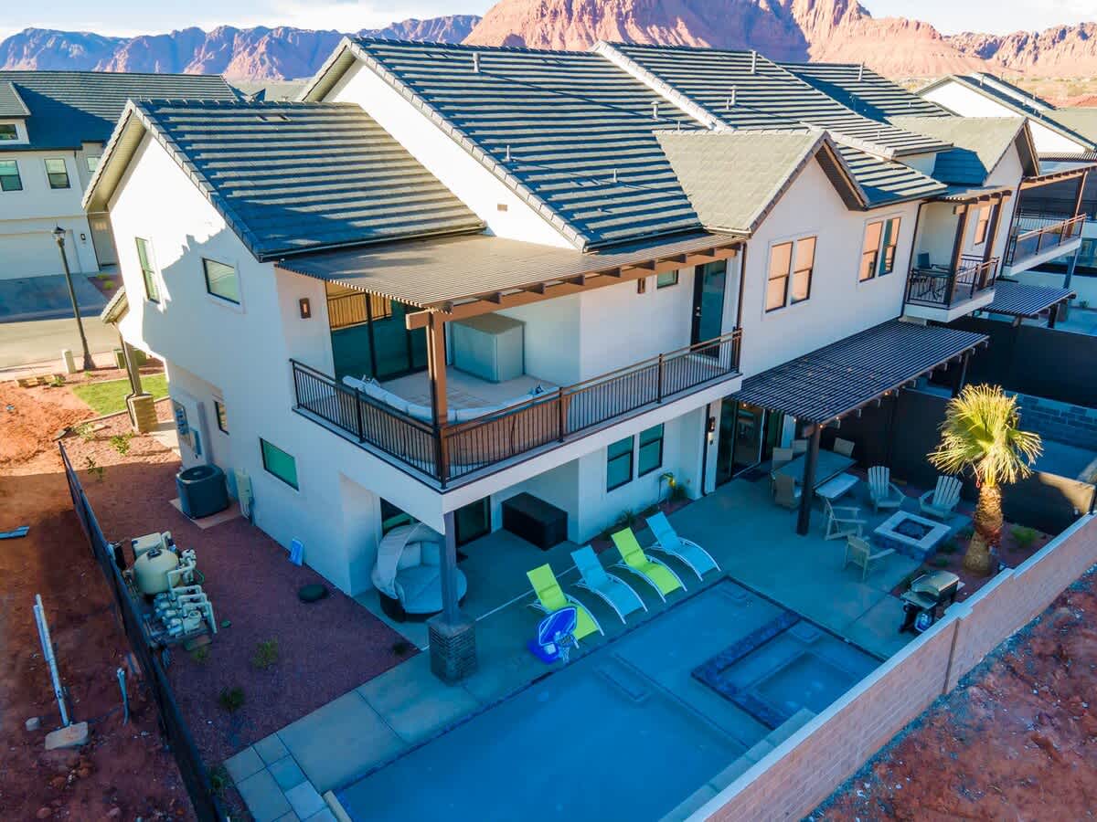 Aerial view of backyard oasis with private pool and hot tub
