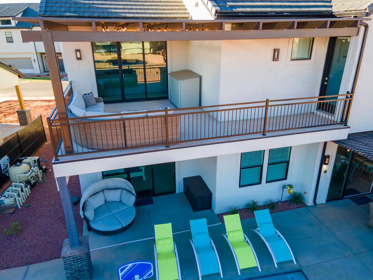 Aerial view of backyard oasis upper balcony and pool