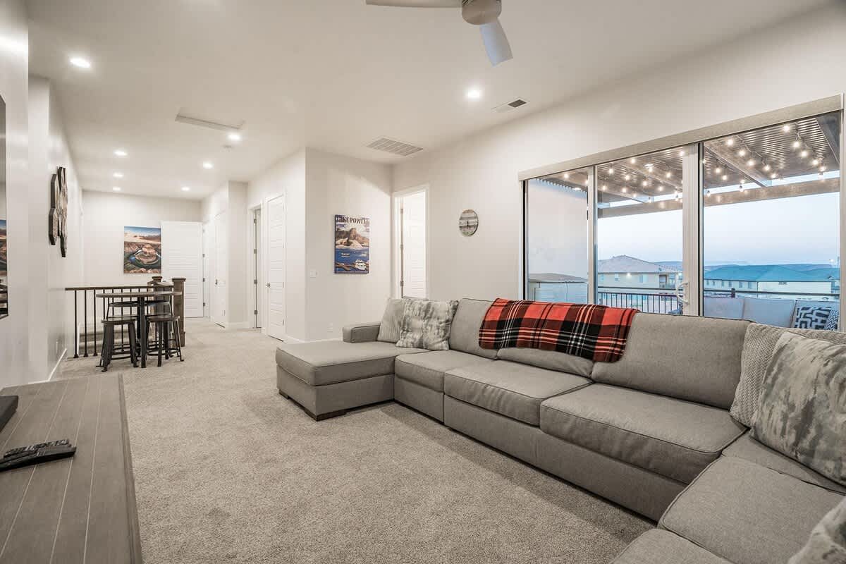 Family room upstairs with patio balcony overlooking pool