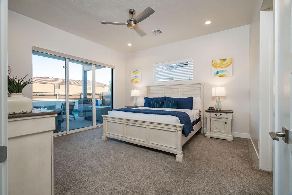 Master bedroom on main level with king bed and pool access