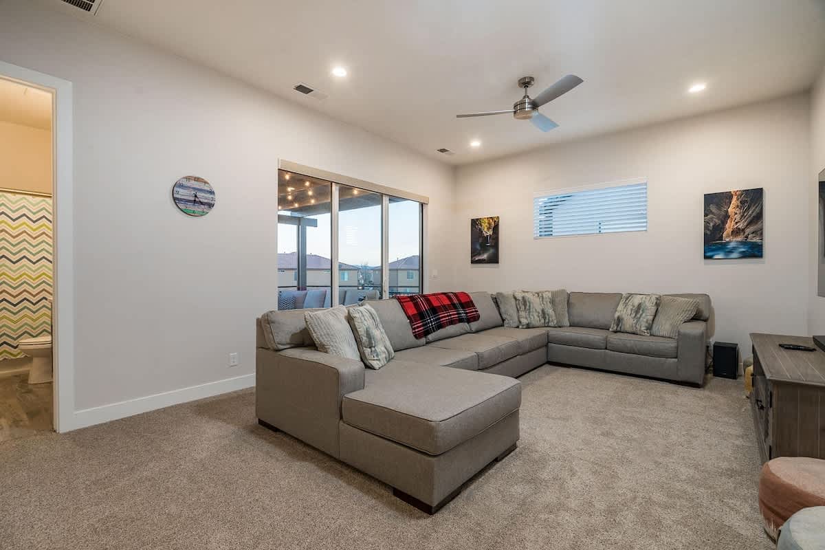 Family room 2 upstairs with large sofa and TV