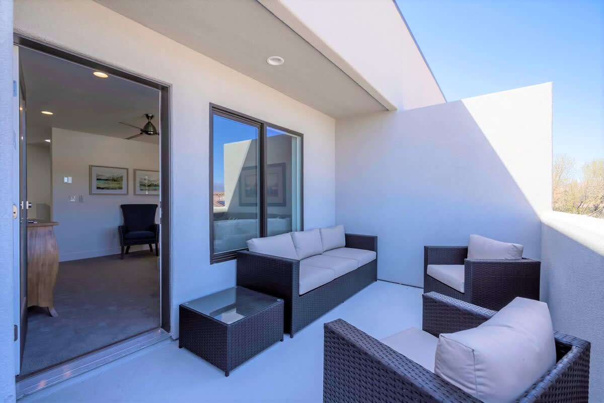 Relaxing balcony with sofa and chairs on 3rd floor