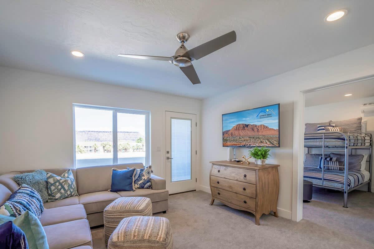 Family room on 3rd floor with large comfortable sectional and TV