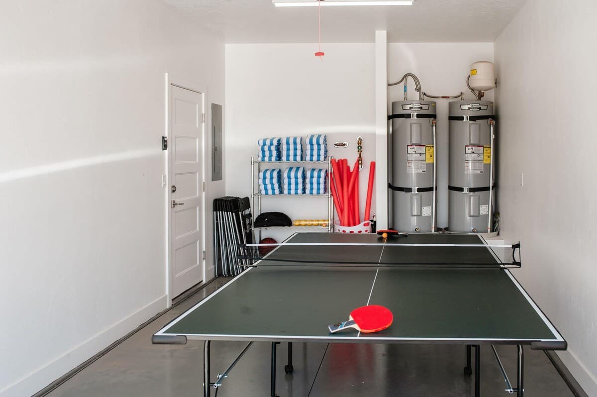 Private ping pong table in garage folds up to park