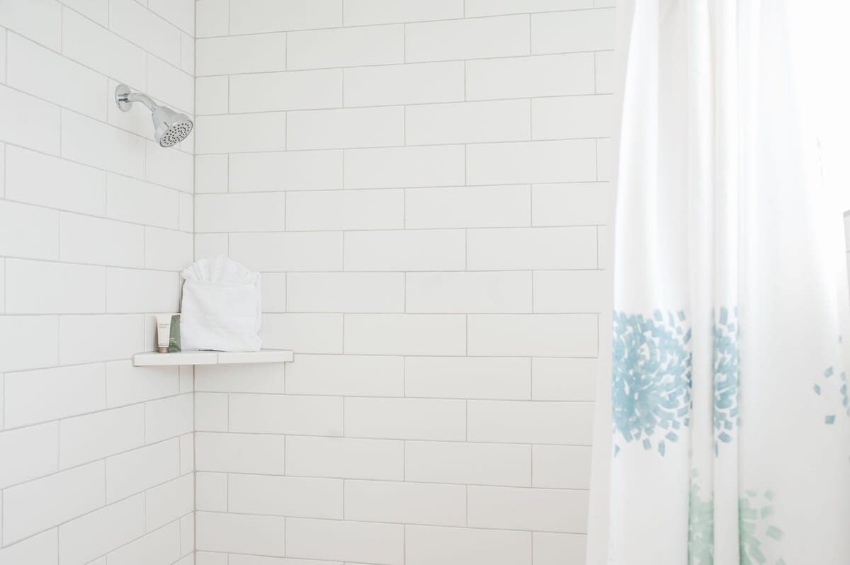 Beautiful modern white tiled shower