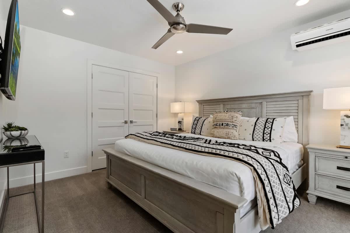 Bedroom 1 with king bed and private balcony patio