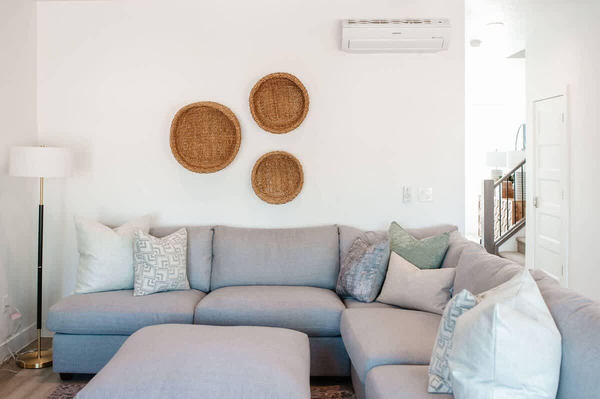 Family room with sectional and TV in house #20