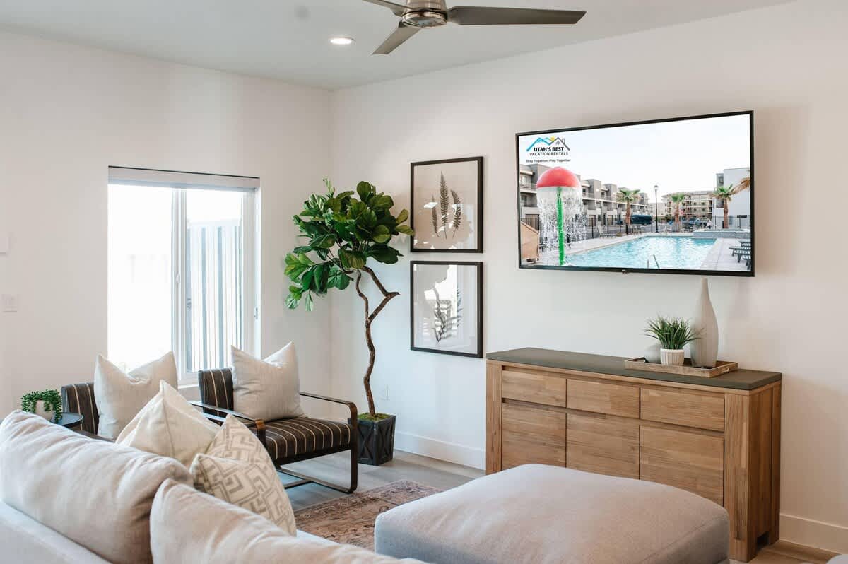 Family room with large TV and sectional in house #20