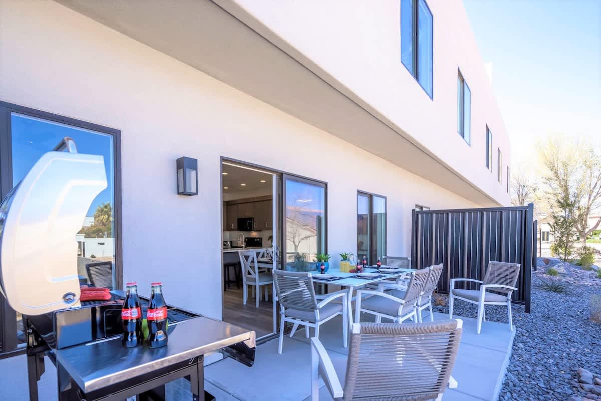 House #19 back patio with BBQ and seating