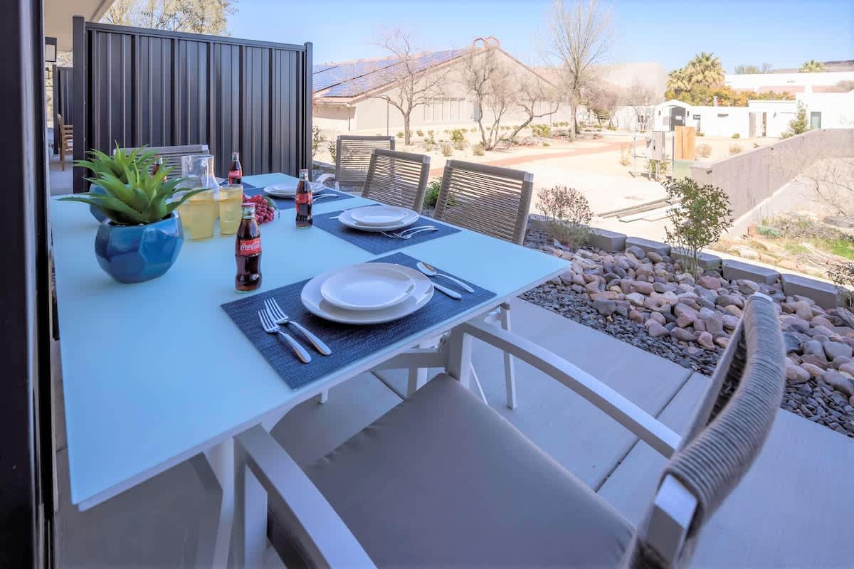 House #19 back patio with seating and BBQ