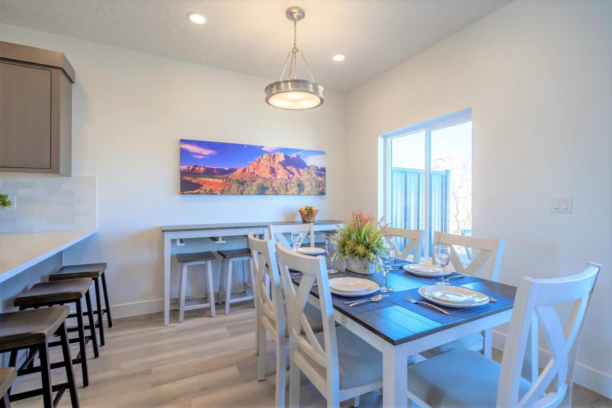 House #19 dining area with table and 2 bars seats 14