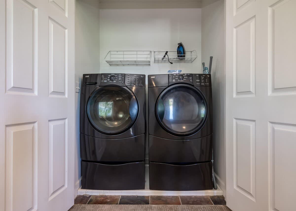Laundry closet with nice front loading washer and dryer