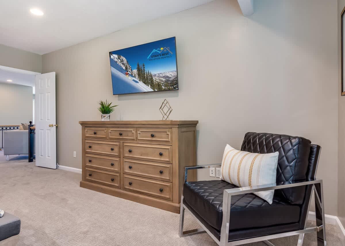 Beautiful leather chair and TV in master