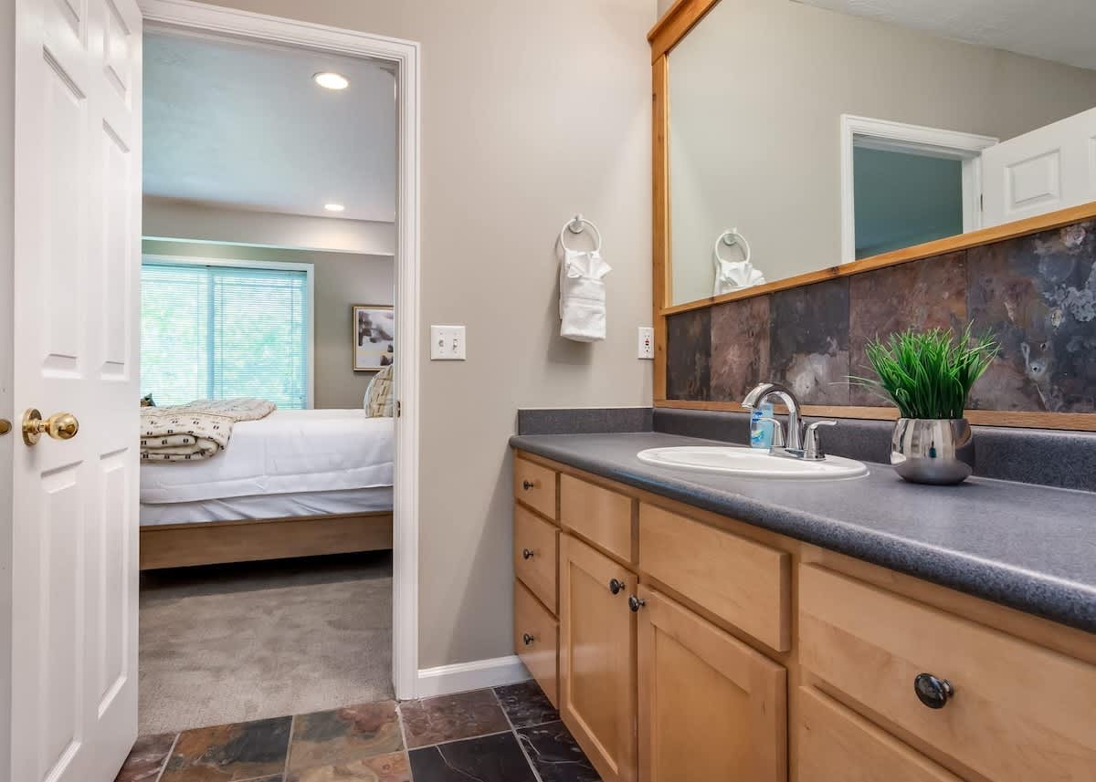 Vanity and slate floor in master bathroom