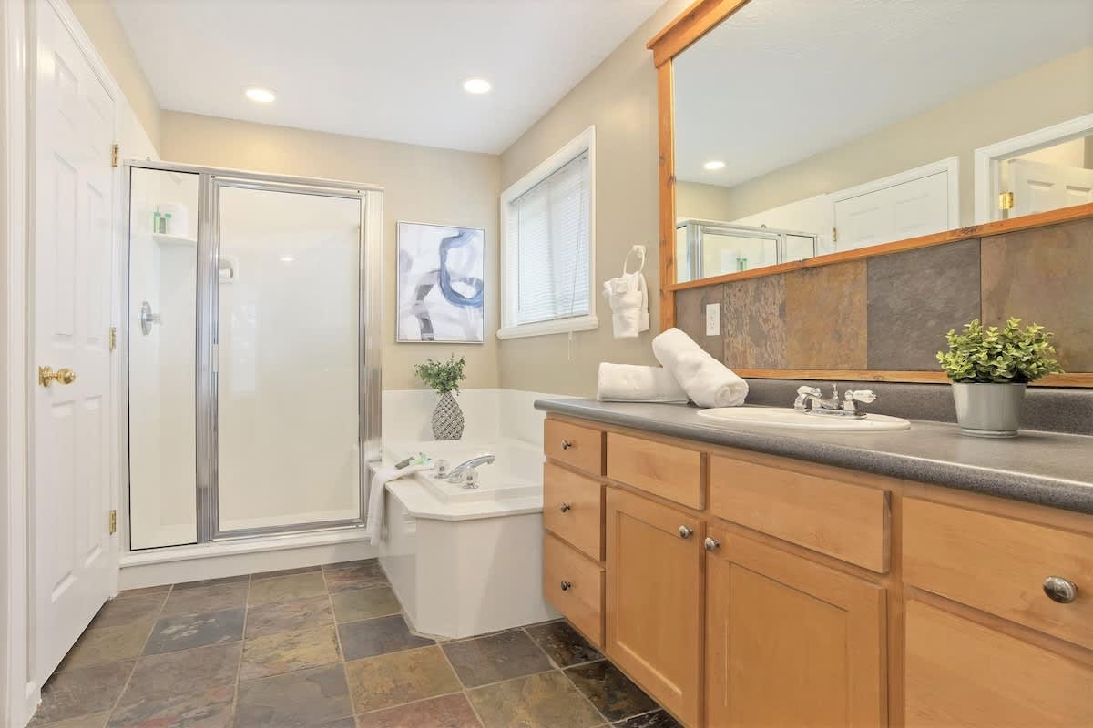 House 2 master bathroom with tub and shower