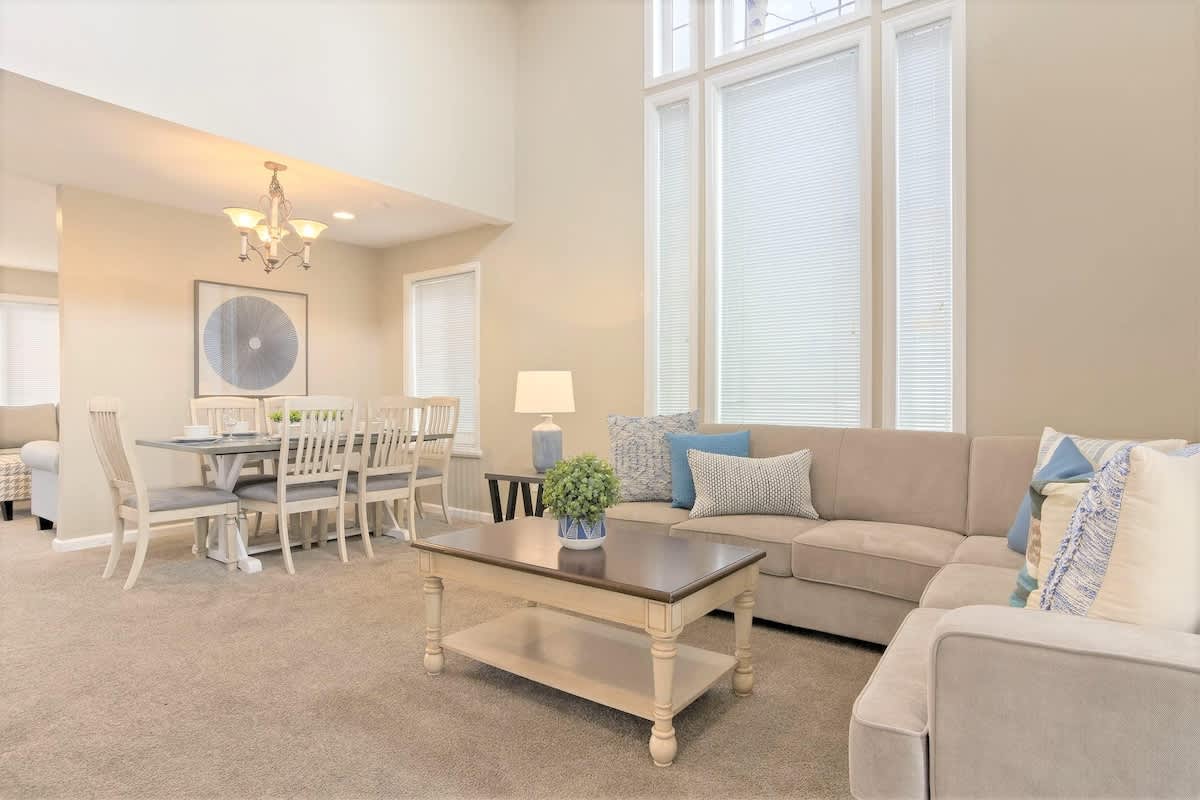 House 2 great room sectional and dining area