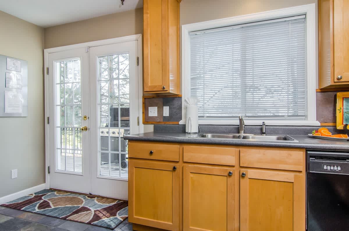 House 3 kitchen with access to deck and private hot tub