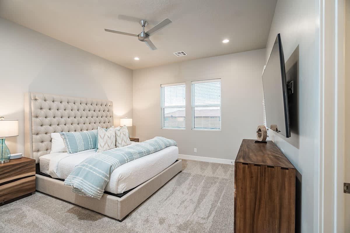 Bedroom 3 with gorgeous tufted king bed and 72-inch smart TV