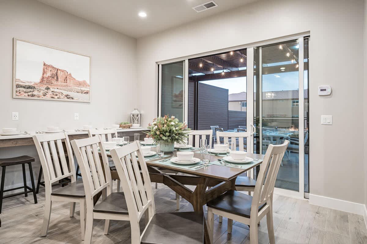 Open concept dining area with dining table for 8 plus 8 stools