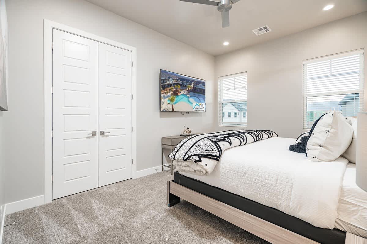 Bedroom 4 with king bed and 72-inch smart TV