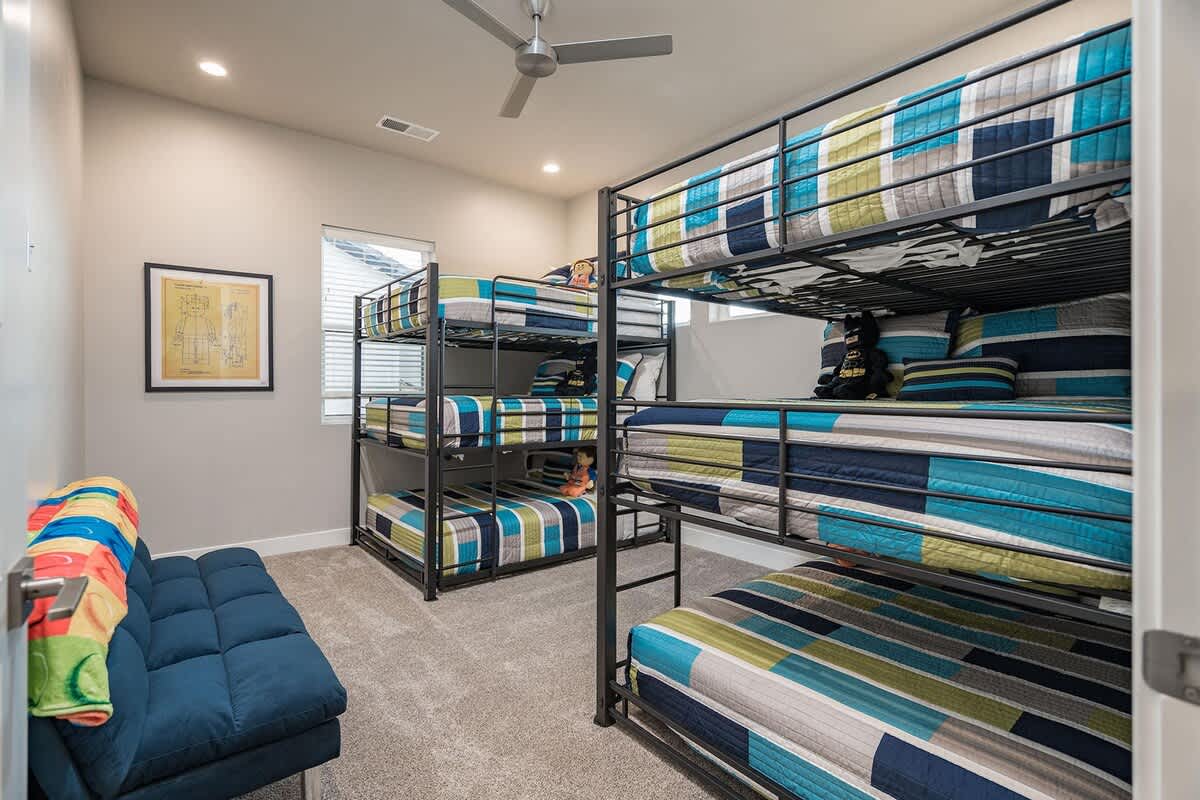 Bedroom 5 bunk room with 2 triple full size bunks and full futon