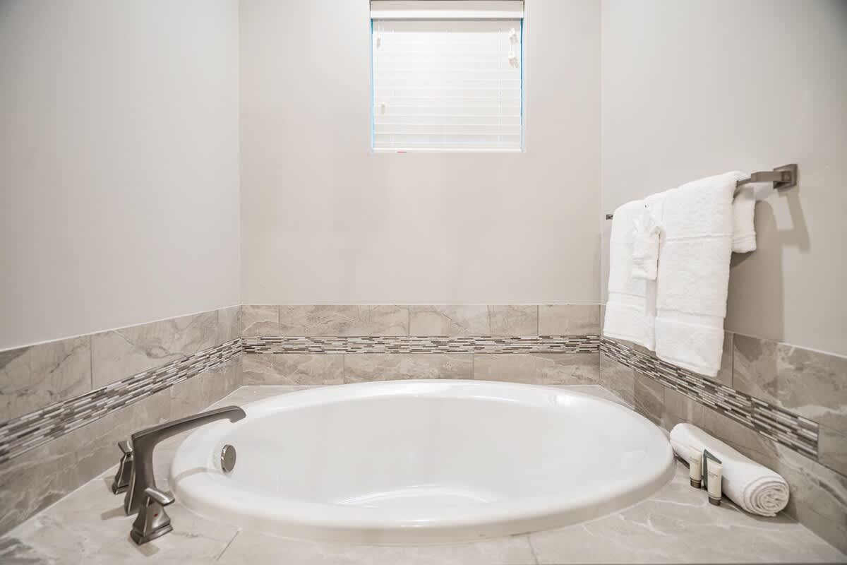 Relaxing tub in master bathroom on main floor