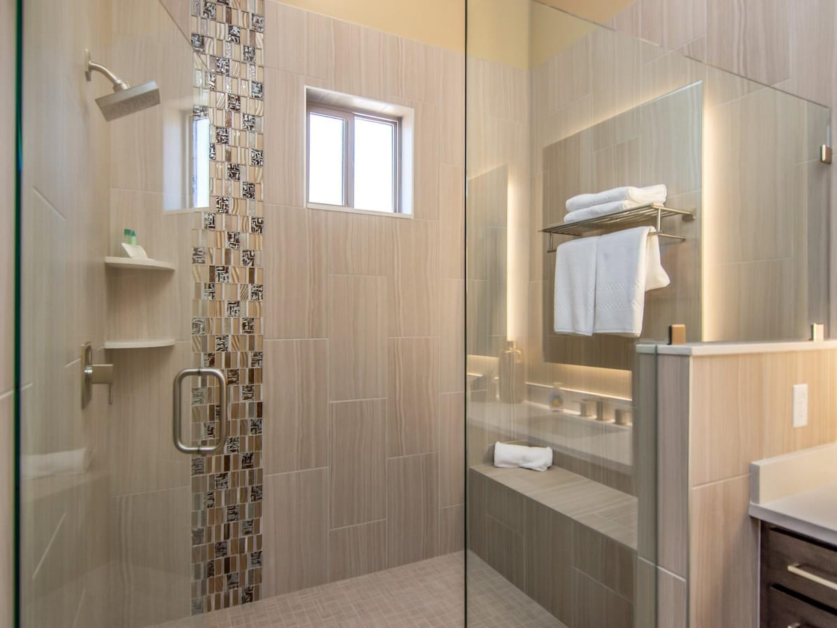 Large luxury shower with custom tile in master bathroom