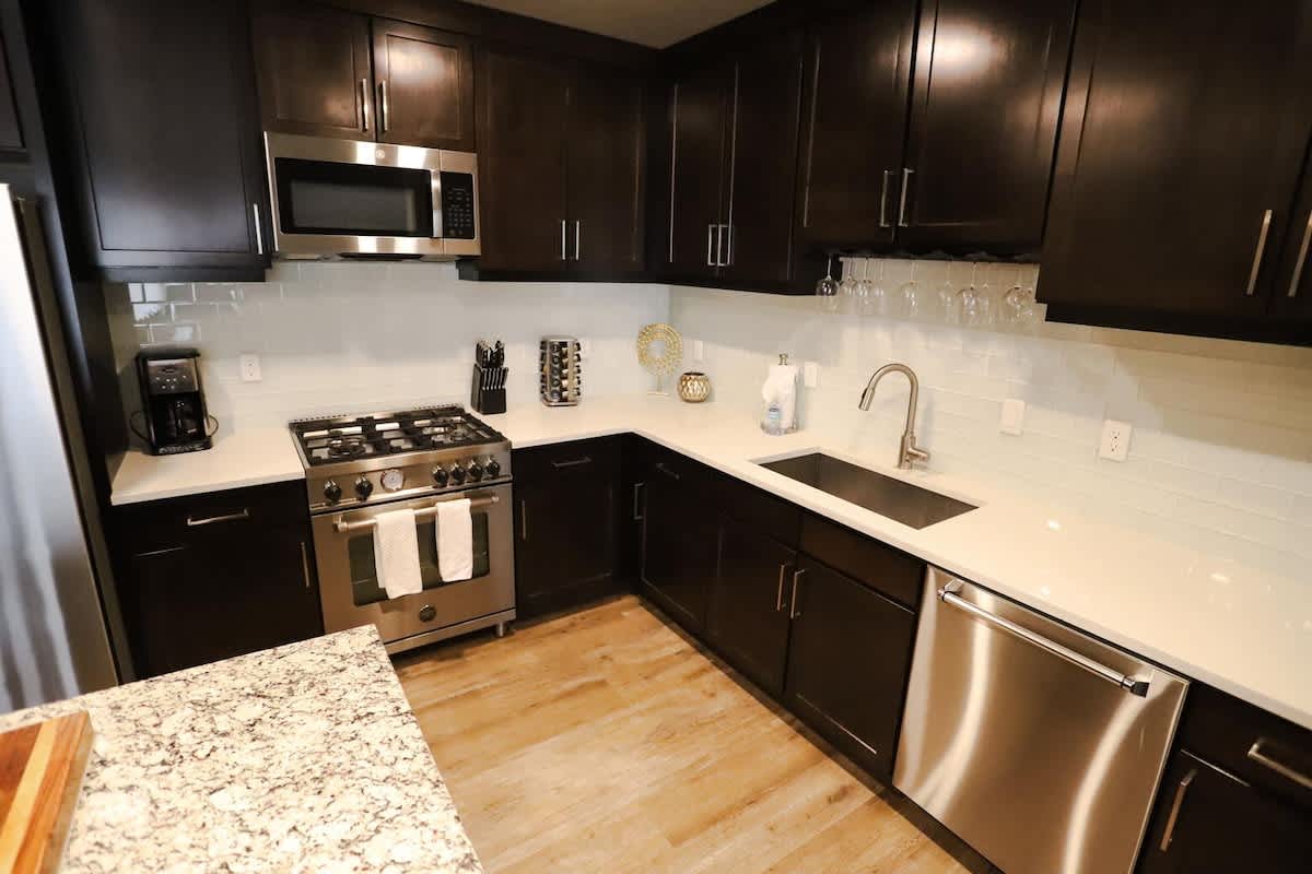 Kitchen bar seats 3 with granite and butcher block counters