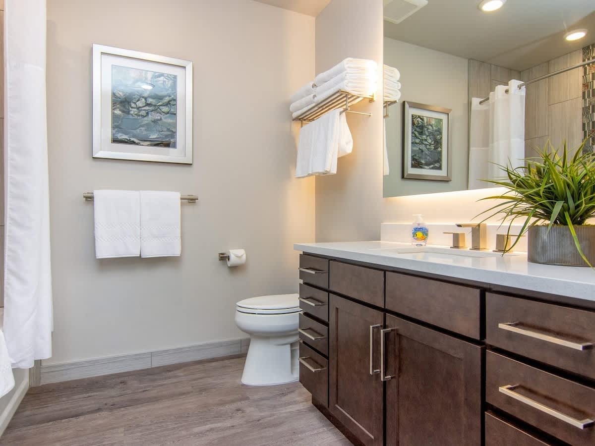 Bathroom 2 with modern vanity and back-lit mirrors
