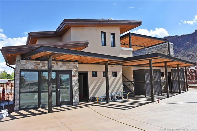 Poolside clubhouse with upper terrace overlooking pool