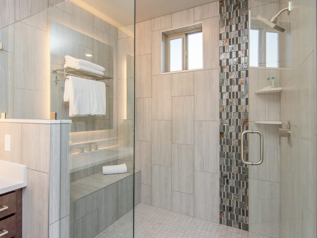 Master bathroom luxury shower with large bench encased with glas
