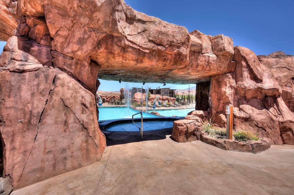 Grotto hot tub under cascading waterfall