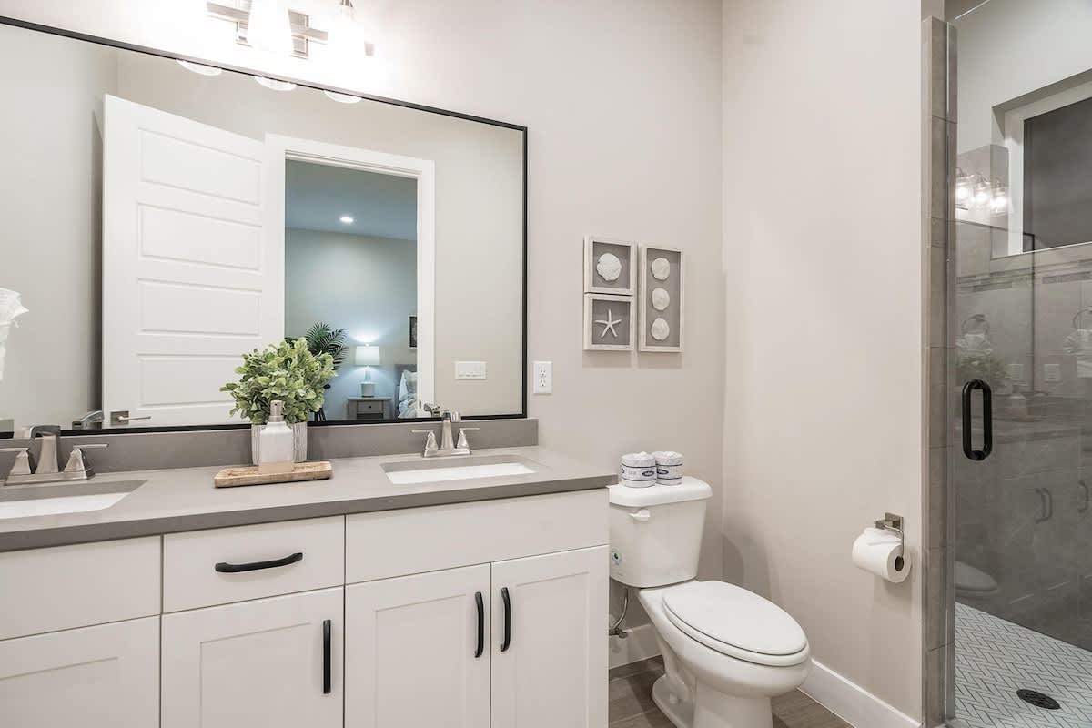Bathroom in bedroom 4 with shower and dual sinks