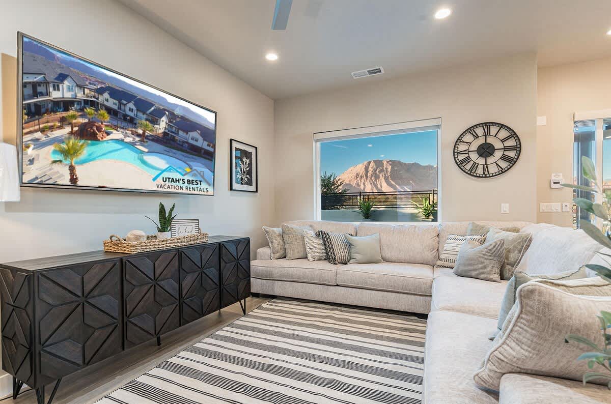 Beautiful family room with sectional, large TV and stunning view