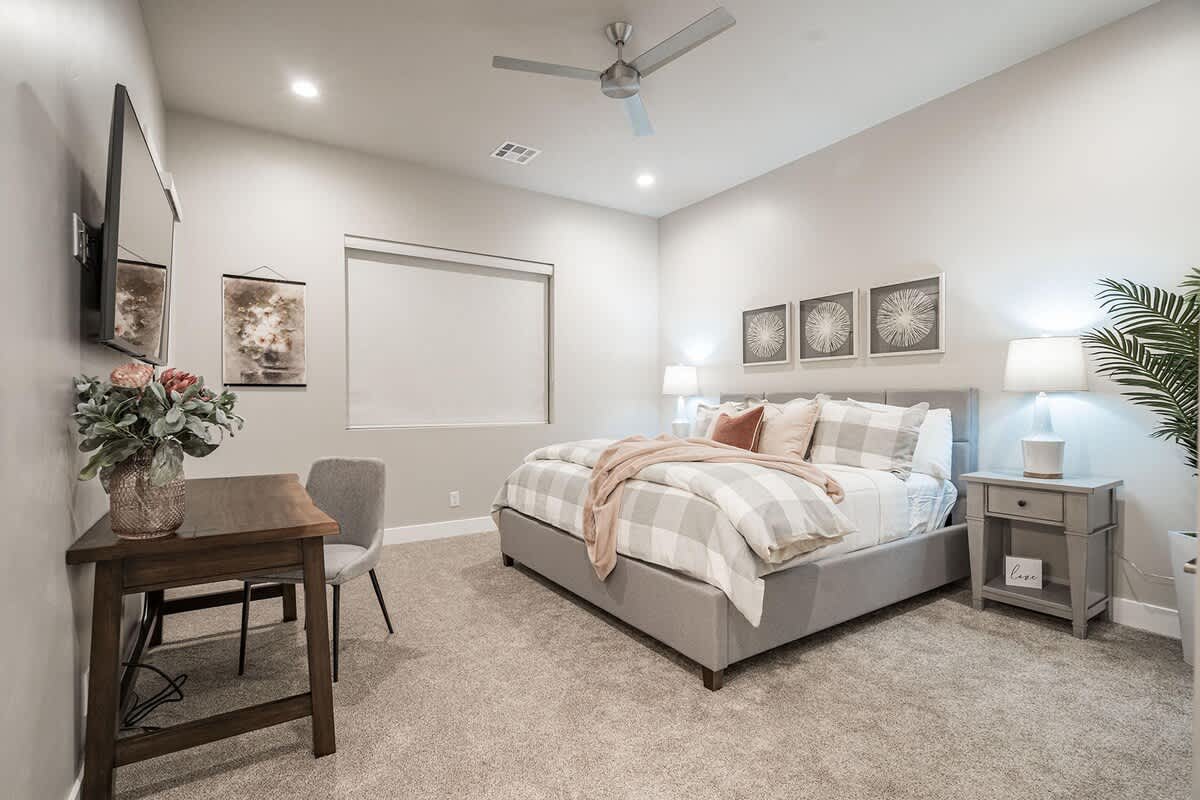 Bedroom 4 with king bed, TV and desk