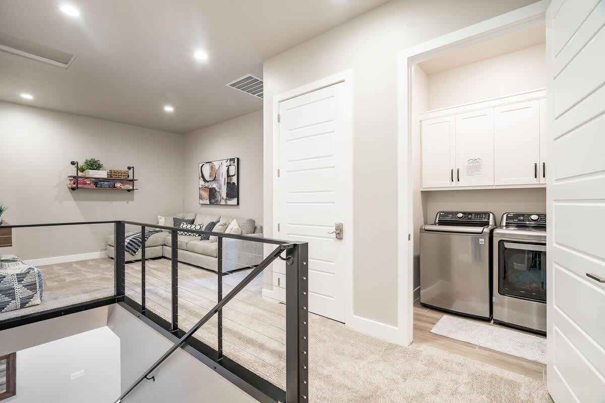 House 29 upper floor laundry room and family room