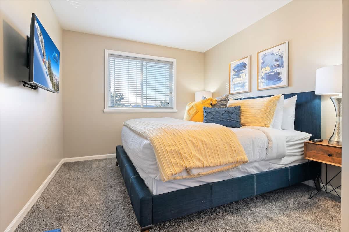 Bedroom 2 with king bed and TV