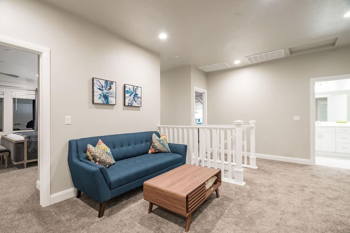 Loft nook on 2nd level with sofa and TV