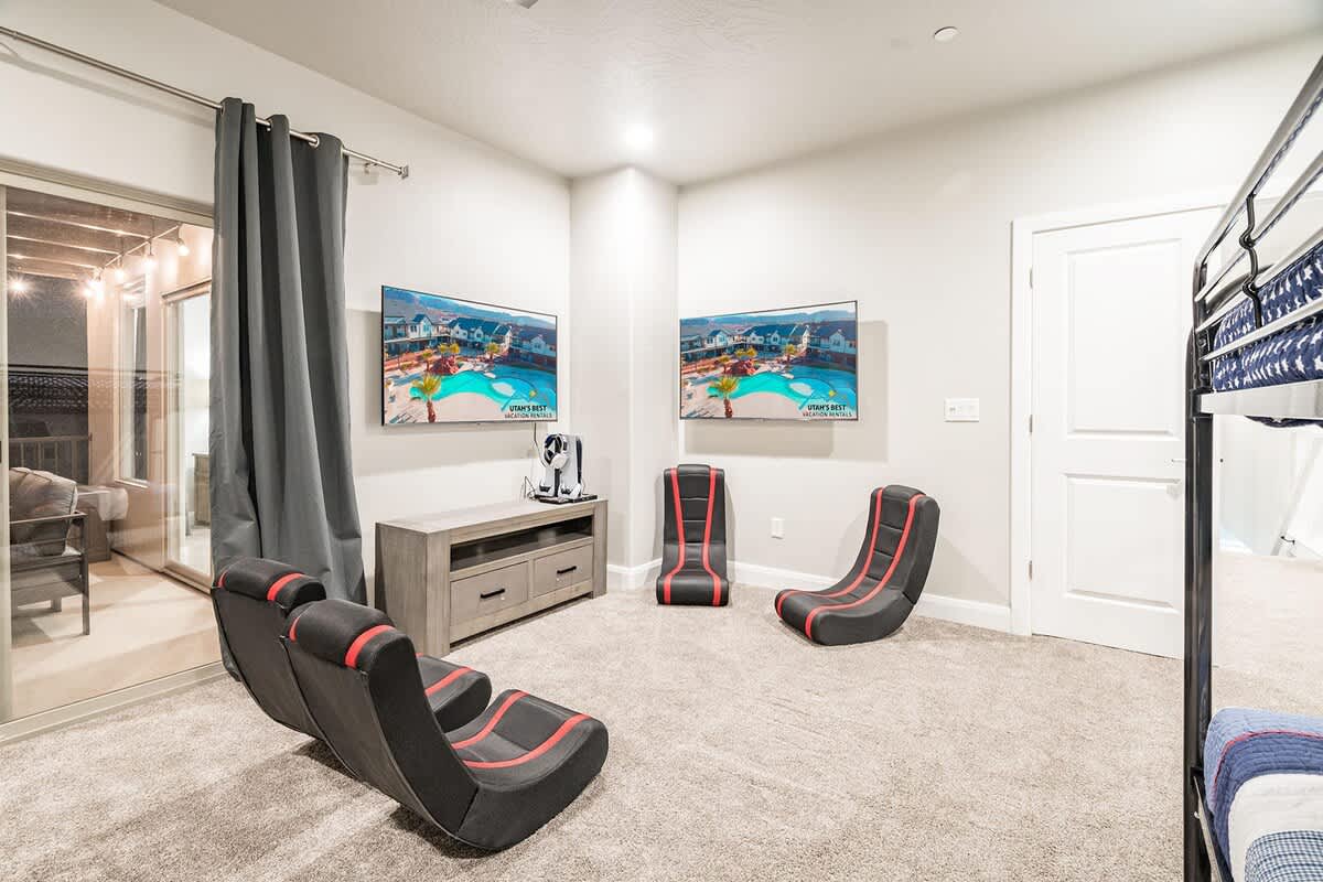 Gaming room with 2 TVs and gaming equipment