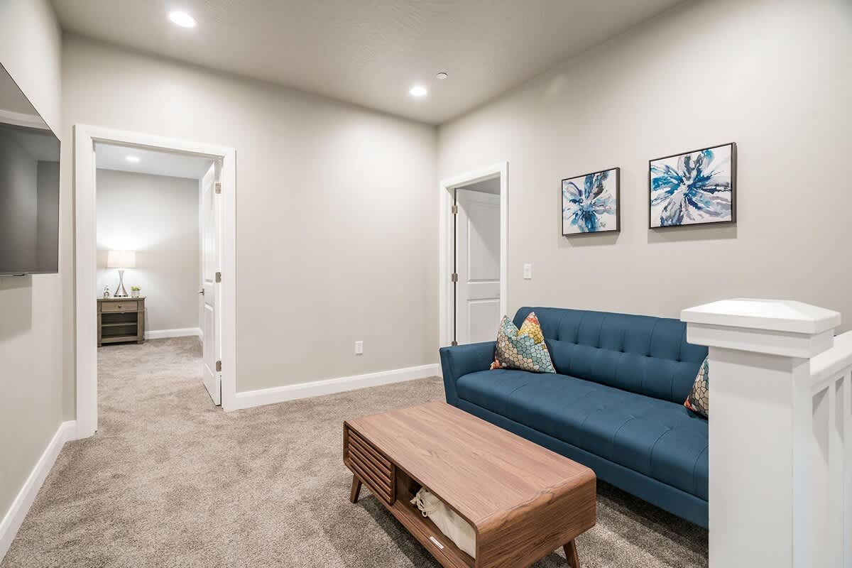 Loft nook on 2nd level with sofa and TV