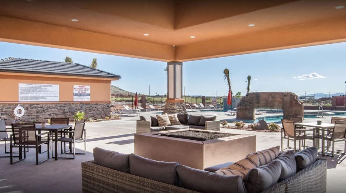 Clubhouse poolside covered lounge with fire pit and seating