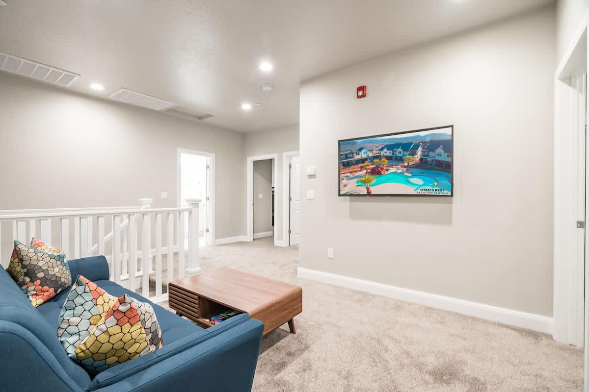 Loft nook on 2nd level with sofa and TV