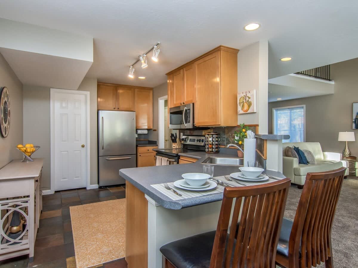 Beautiful full kitchen with bar seating in Union Meadows home