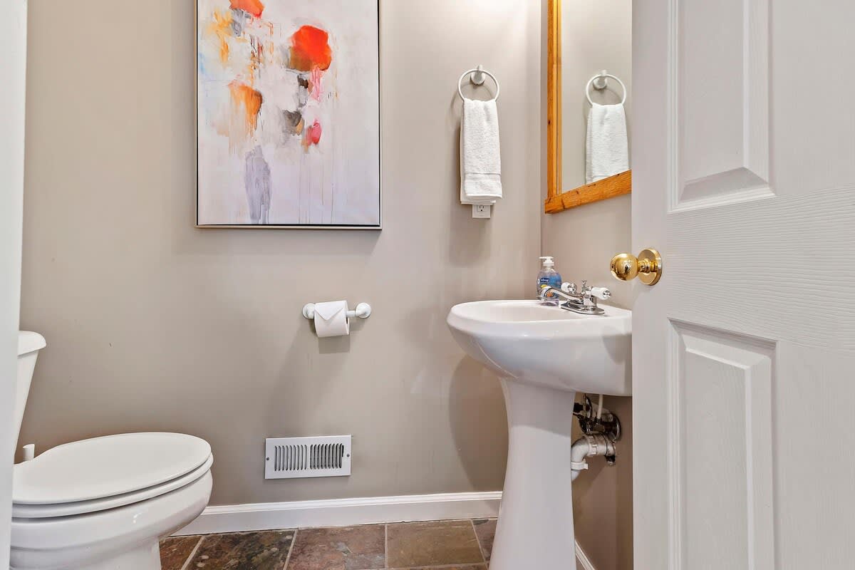 Half bathroom off kitchen in Union Crossroads home