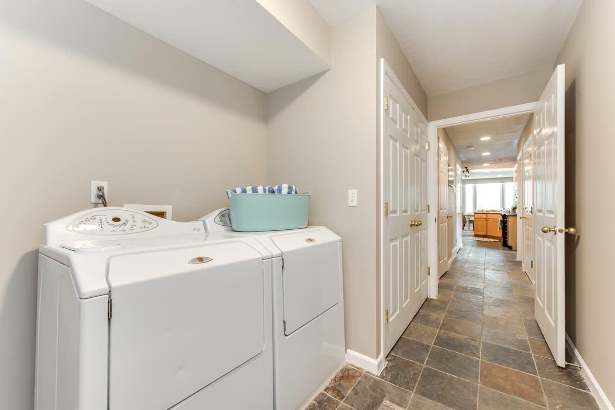 Laundry room on main level in Union Woods home